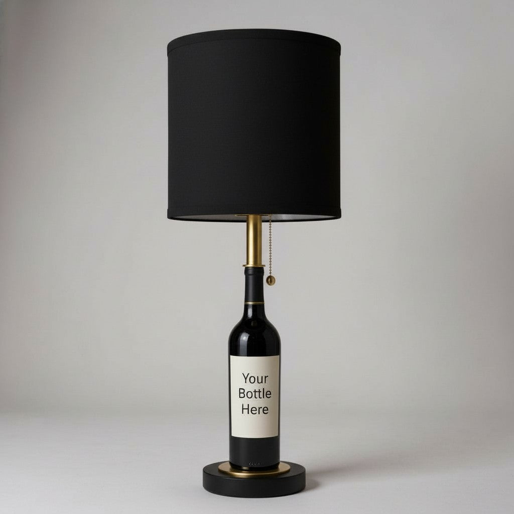 Custom black table lamp made from a wine bottle with a label displaying "Your Bottle Here," set against a studio background