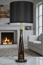 Liquor bottle lamp made from a reclaimed Don Julio 1942 Tequila bottle, full view, light off, in a cozy living room