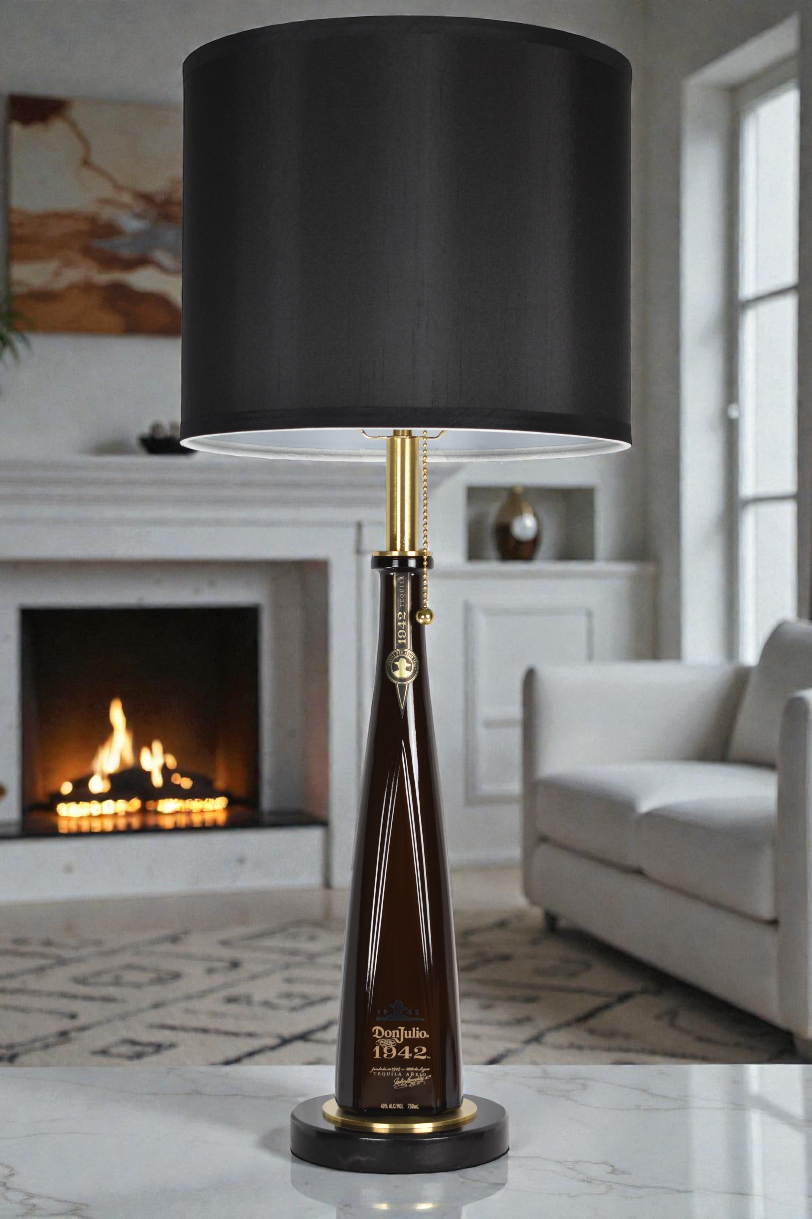 Liquor bottle lamp made from a reclaimed Don Julio 1942 Tequila bottle, full view, light off, in a cozy living room