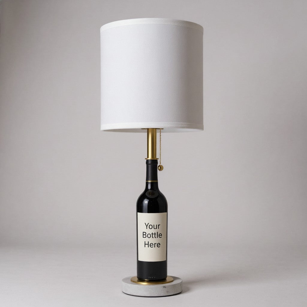 Custom white table lamp made from a wine bottle with a label displaying "Your Bottle Here," set against a studio background