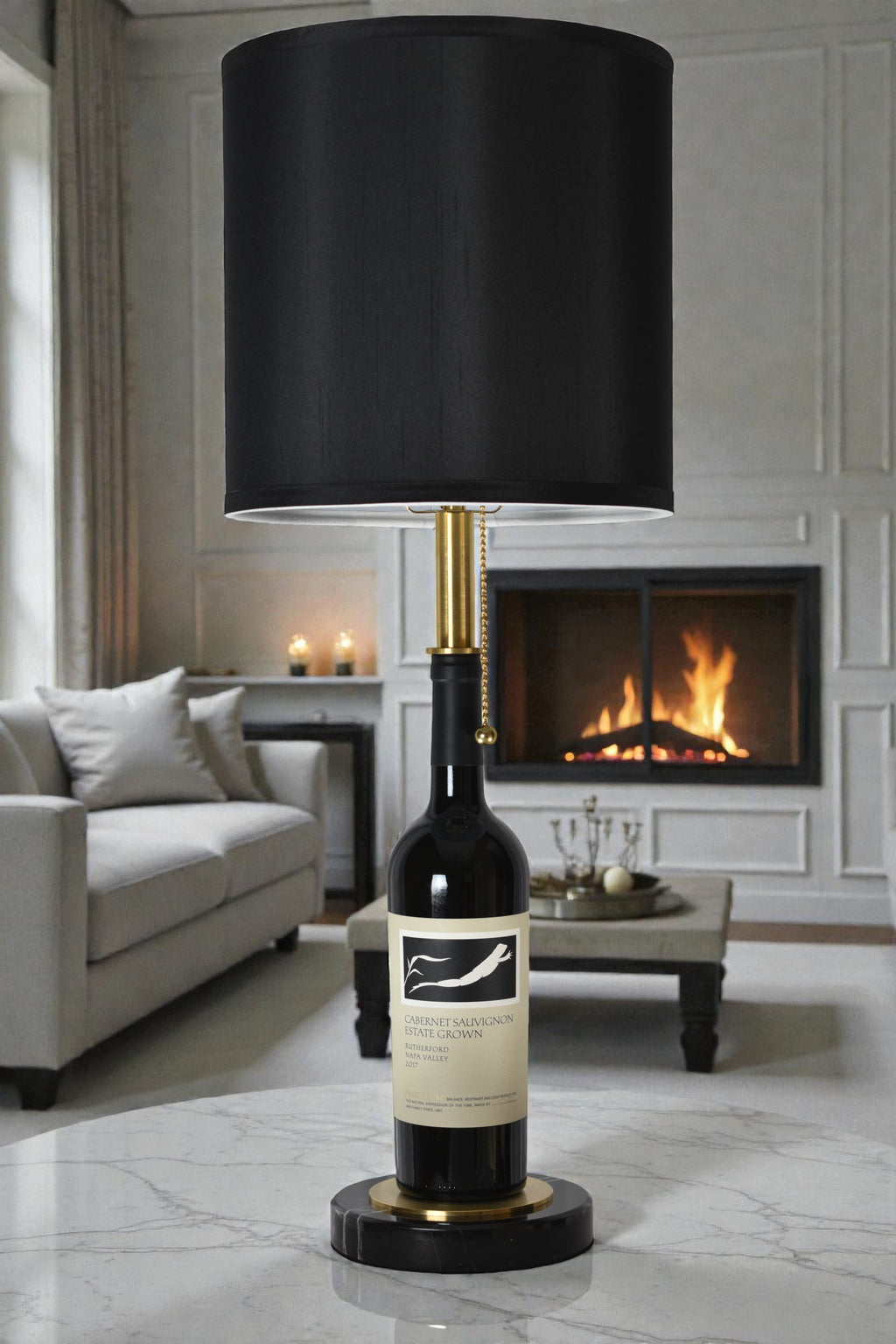 Wine bottle lamp made from a reclaimed 2017 Frog's Leap Cabernet Sauvignon bottle, full view, light off, in a cozy living room
