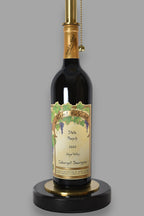 Wine bottle lamp made from a reclaimed 2022 Nickel & Nickel Cabernet Sauvignon bottle, close-up view, on a gray background