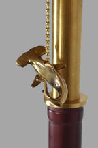 Wine bottle lamp made from a reclaimed 2014 O'Leary Cabernet Sauvignon bottle with a brass shark pull-chain ornament