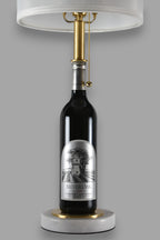 Wine bottle lamp made from a reclaimed 2020 Silver Oak Cabernet Sauvignon bottle, front view, on a gray background